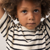 Children wearing striped shirts