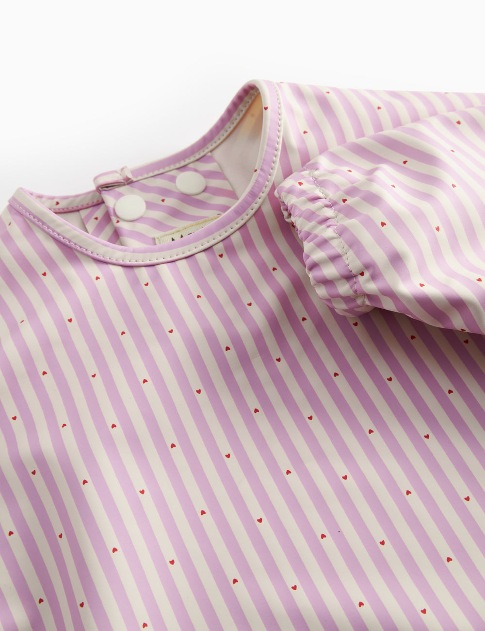 Langärmet spiseforklæde med lyserøde striber og lomme til børn

Translation: Long-sleeved tablecloth with bright red stripes and pockets for children