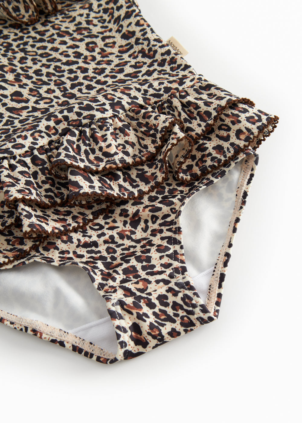 Bathroom wear for children with leopard pattern, narrow straps, and front flap.