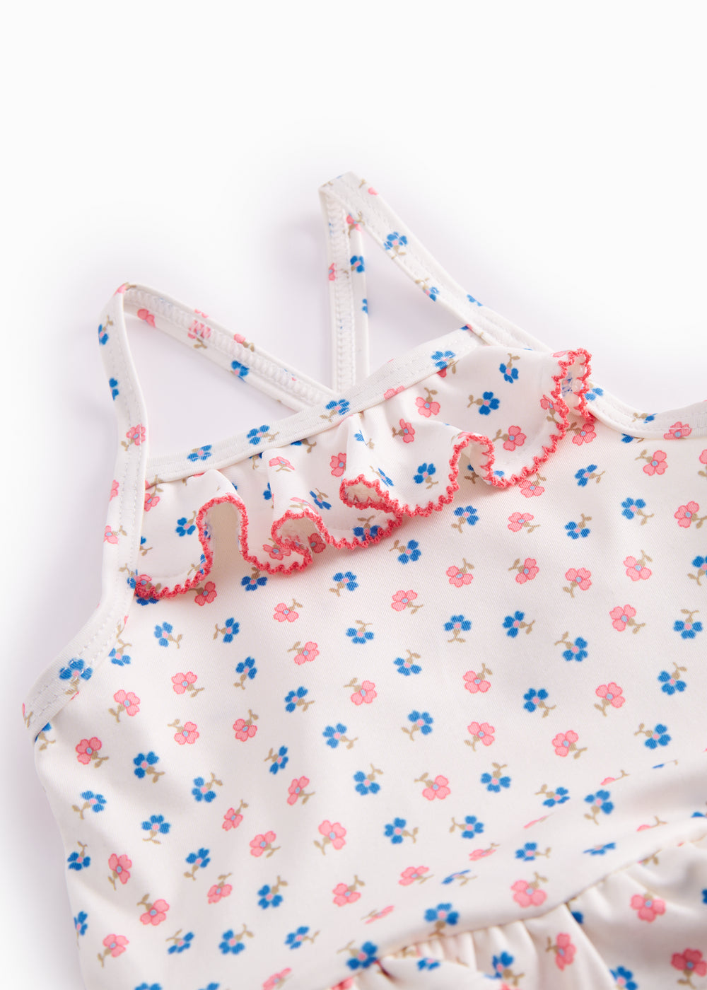 Children's swimwear with flowers and lace.