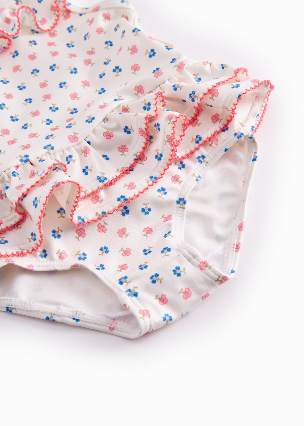 Children's swimwear with flowers and lace.