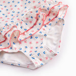 Children's swimwear with flowers and lace.