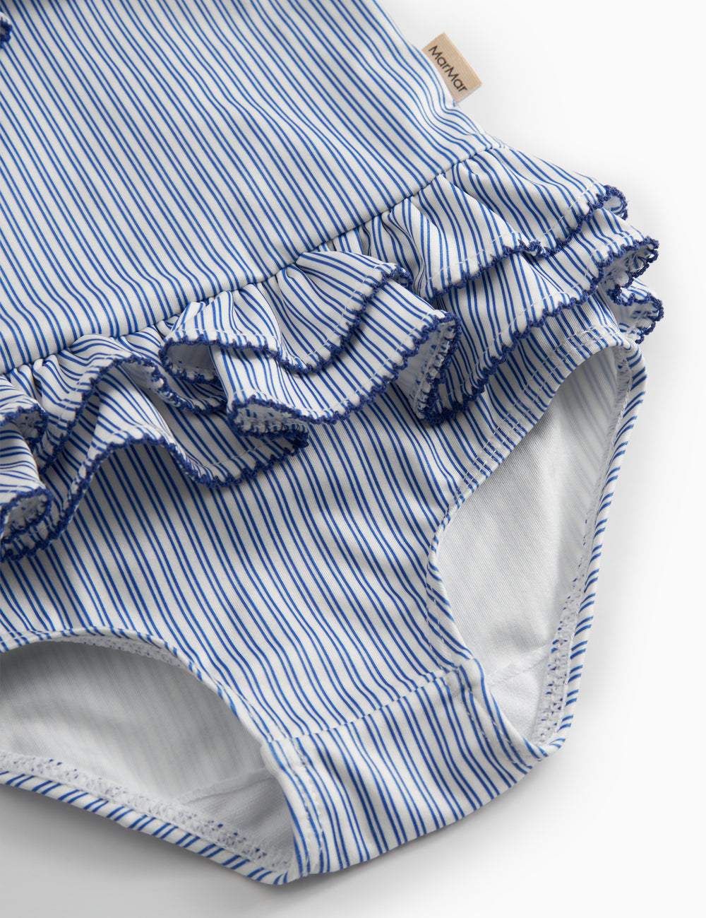 Children's swimwear with blue stripes and ruffles.