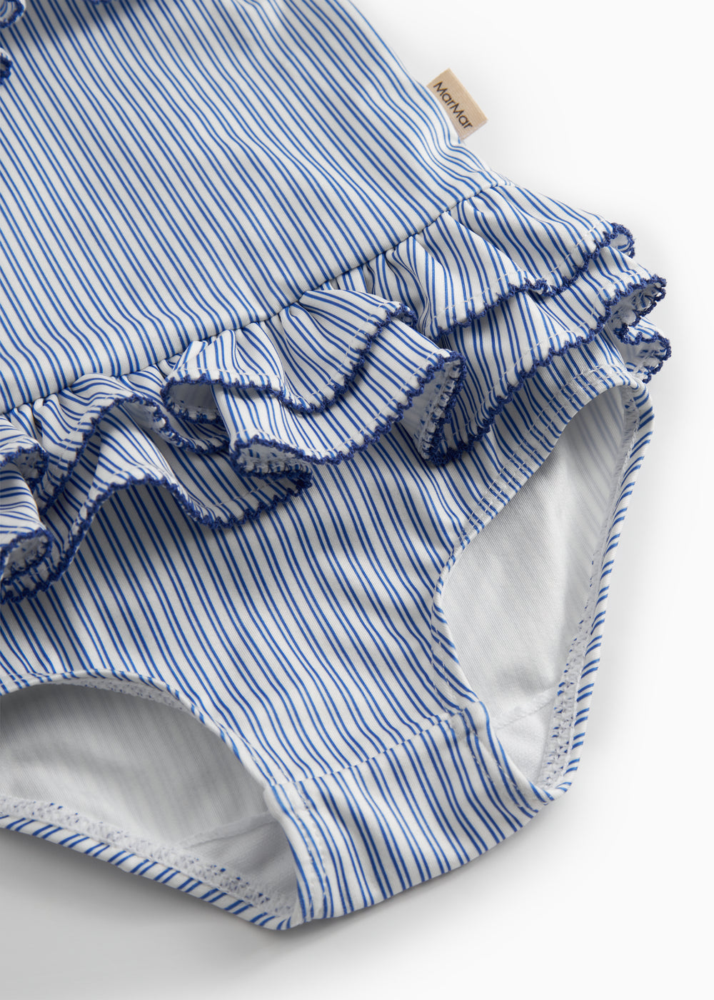 Children's swimwear with blue stripes and ruffles.