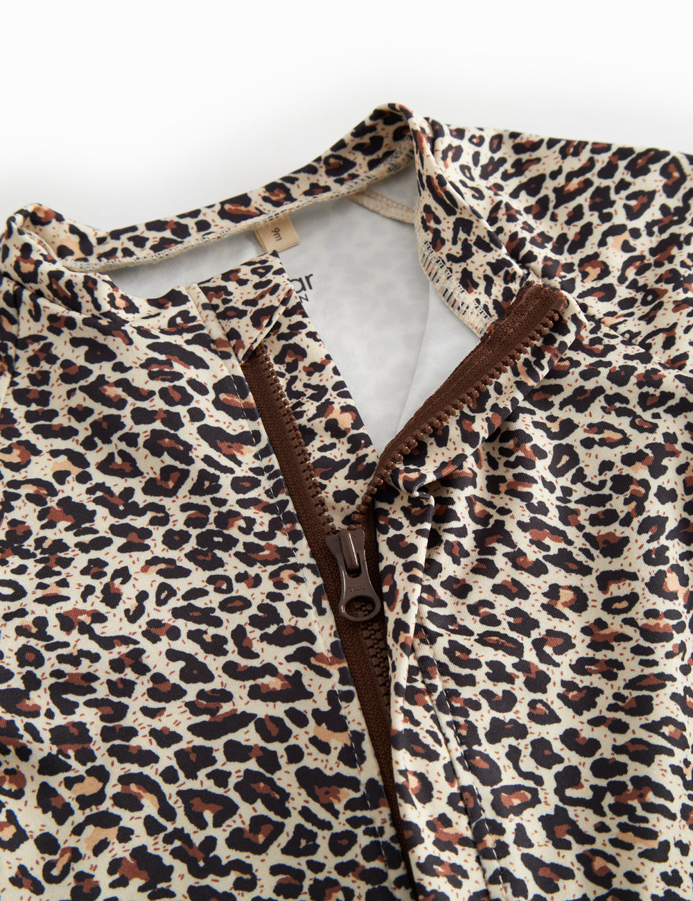 Bathing suit for children with brown leopard print and zipper.
