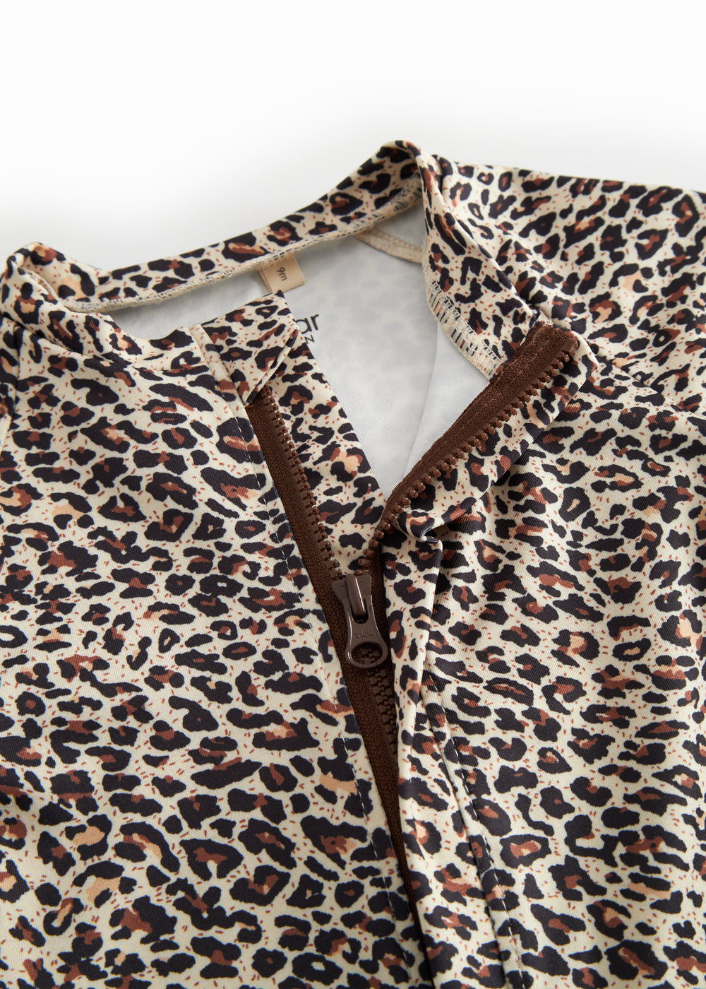 Bathing suit for children with brown leopard print and zipper.