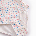 Children's swimwear with a floral pattern and flounces.