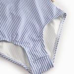 Children's swimwear with blue stripes and ruffles.