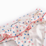 Bikini for children with flower pattern and ruffles.