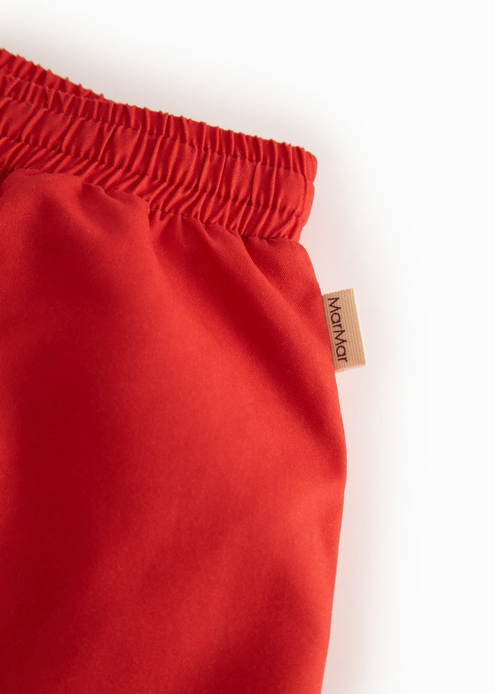 Red swim trunks for children with drawstring
