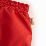 Red swim trunks for children with drawstring