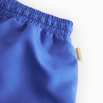 Blå badeshorts  med stropper til børn