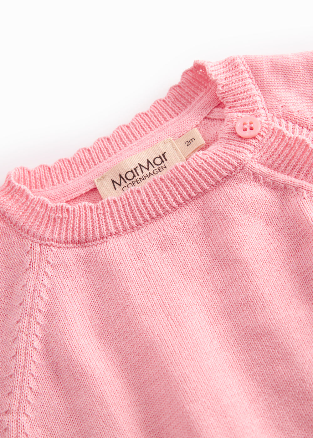 Rosa strikbluse med knapper til baby
