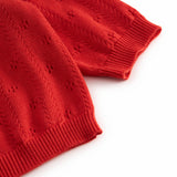 Red striped cardigan for baby, with a pretty lace pattern and button closure.