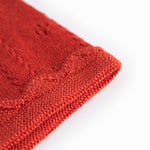 Red polka dot baby helmet with ties