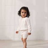 Patched striped cardigan with a delicate hole pattern and button closure, matching shorts.