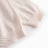 Stylish baby cardigan with a cute pattern and button closure.