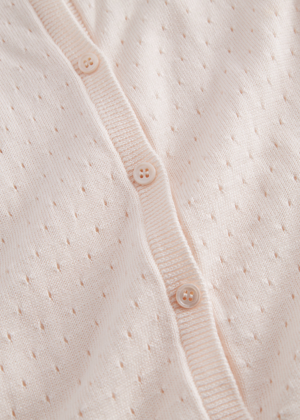 Striped cardigan for children with a fine pattern and button closure.