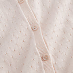 Striped cardigan for children with a fine pattern and button closure.