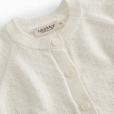 White striped cardigan for baby, with a pretty hole pattern and button closure.