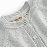 Green striped cardigan for baby, with a pretty lace pattern and button closure.