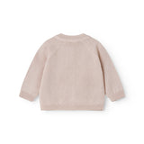 Lyserød strik cardigan til baby, med fint hulmønster og knaplukning