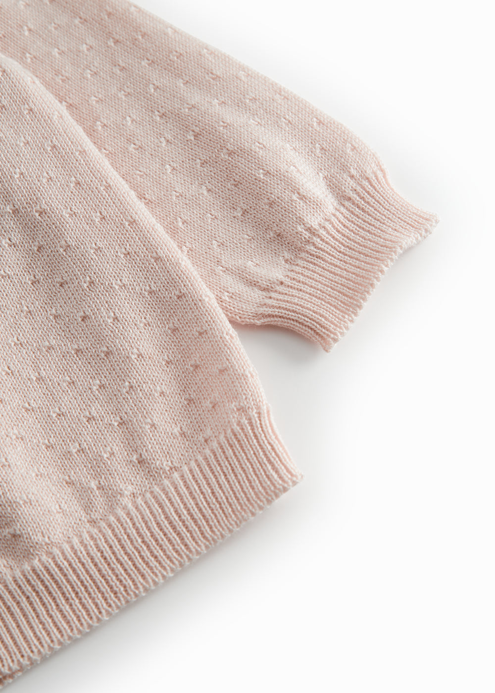 Red striped cardigan for baby, with a pretty lace pattern and button closure.