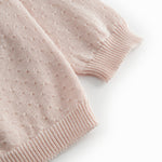 Red striped cardigan for baby, with a pretty lace pattern and button closure.