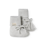 Green striped baby food with a ribbed edge and tie.