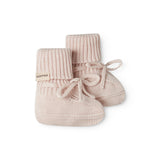 Red baby food in bright red with a ribbed edge and a tie.