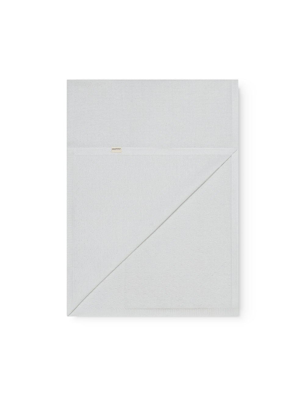 Green baby blanket with a hole pattern