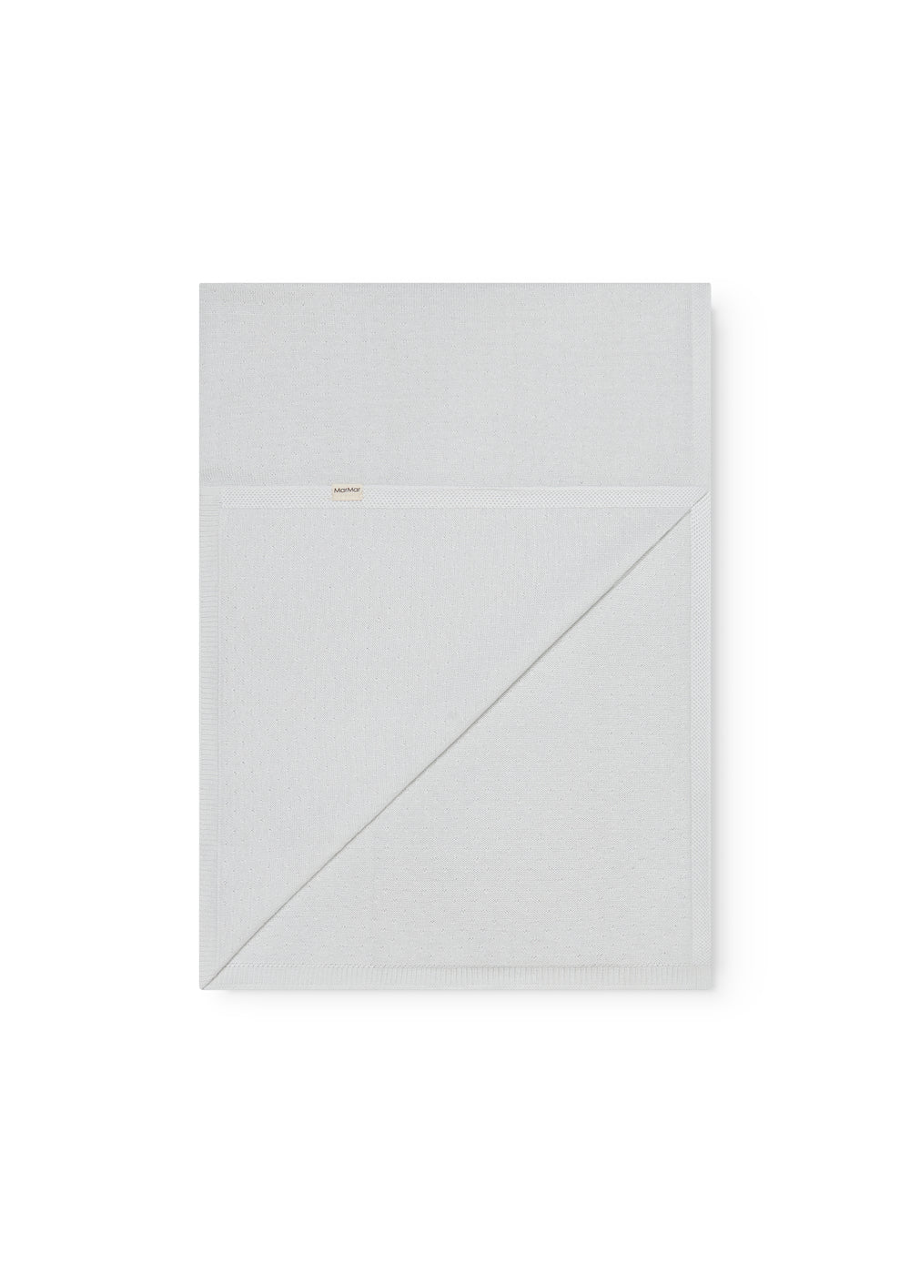 Green baby blanket with a hole pattern