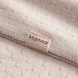 Red baby blanket with a hole pattern