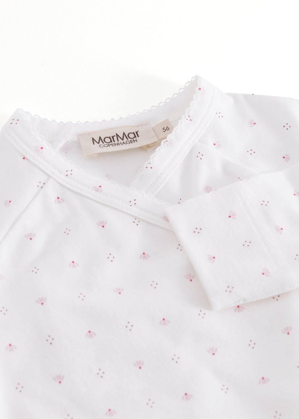 White baby bodysuit with small flowers