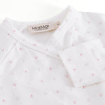 White baby bodysuit with small flowers