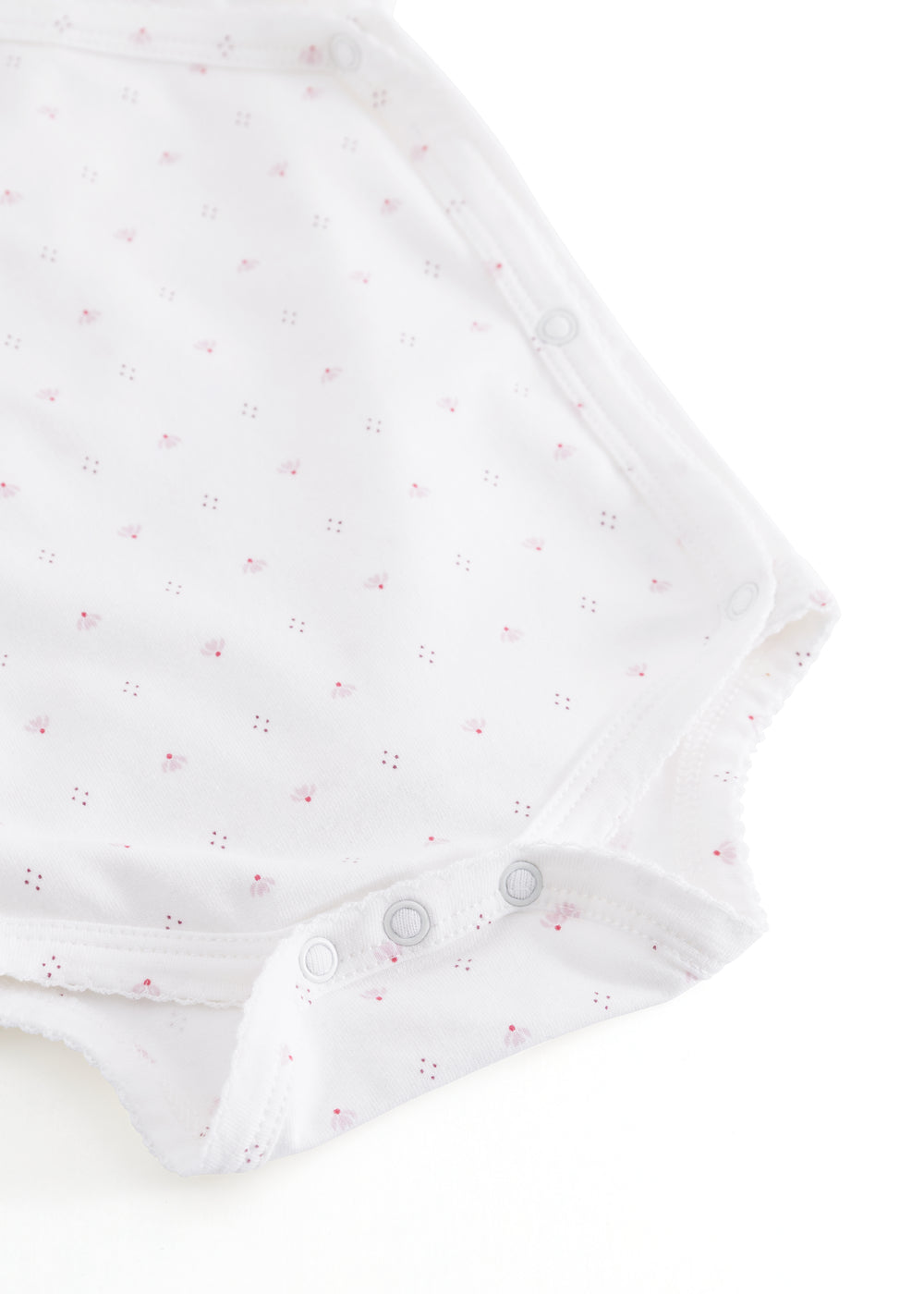 White baby bodysuit with small flowers