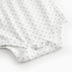 White baby bodysuit with fine pattern