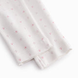 White baby trousers with small flowers