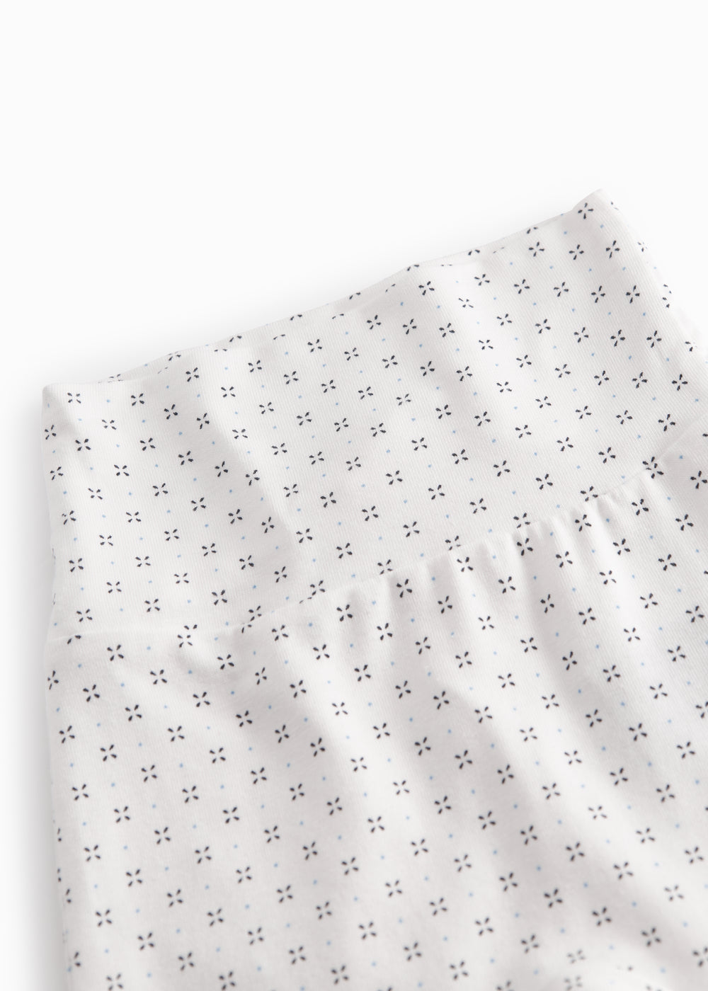 White baby trousers with fine pattern
