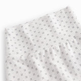 White baby trousers with fine pattern