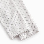 White baby trousers with fine pattern