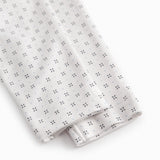 White baby trousers with fine pattern
