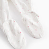 White baby trousers with feet and a fine floral pattern