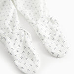 White baby trousers with feet and a fine pattern
