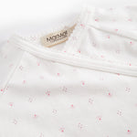White baby romper without legs with fine floral pattern