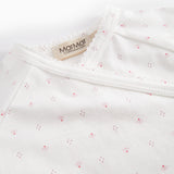 White baby romper without legs with fine floral pattern