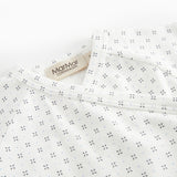White baby sleepsuit without legs with fine pattern