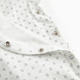 White baby sleepsuit without legs with fine pattern