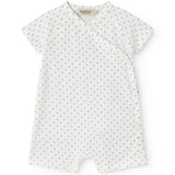 White baby sleepsuit without legs with fine pattern