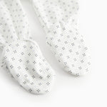 White baby all-in-one with feet in fine pattern